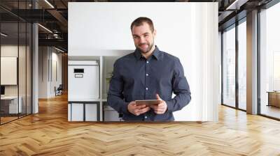 man in office with tablet Wall mural