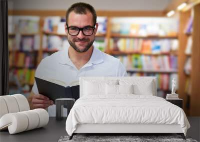 Portrait of a man in a bookstore Wall mural