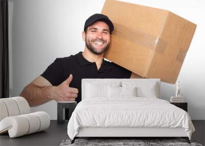 Smiling delivery man giving cardbox Wall mural