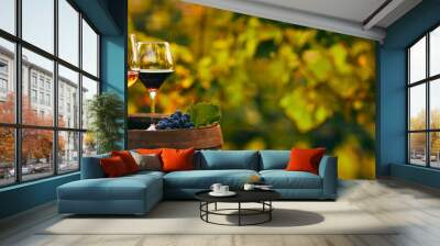 Three glasses of white, rose and red wine on a wooden barrel. Panoramic photo Wall mural