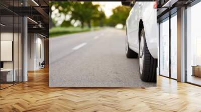 white car standing on the road with copy space Wall mural