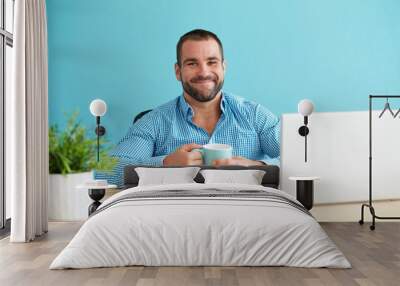 young man in office holding a mug Wall mural