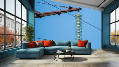 High-voltage electrical insulator electric line against the blue sky Wall mural