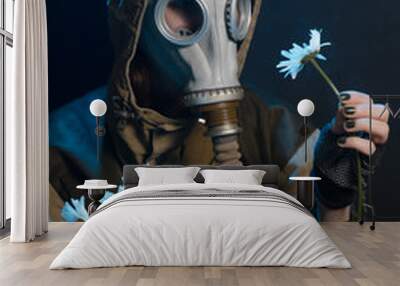 the photo of girl in gas mask on grey background c daisies Wall mural