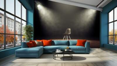 Spotlights illuminate empty stage with chair in dark background. 3d rendering Wall mural