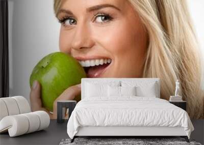 beautiful blond Caucasian woman eating apple, AI generated Wall mural