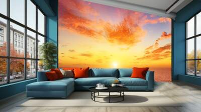 Beautiful colorful sunset at the sea with dramatic clouds and sun shining. Beauty world natural outdoors travel background Wall mural