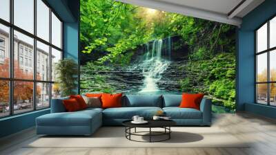 Beautiful mountain rainforest waterfall with fast flowing water and rocks, long exposure. Natural seasonal travel outdoor background with sun shihing Wall mural