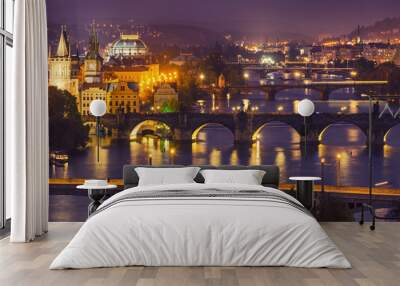 Night view of famous european Prague city - the capital of Czech republic with reflection in river Vltava and historical bridges Wall mural