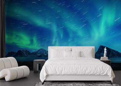 Northern Lights, Aurora Borealis shining green in night starry sky with star tracks at winter Lofoten Islands, Norway Wall mural