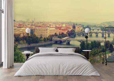 Panoramic view of old beautiful Prague city with red roofs and bridges through the river Vltava, vintage retro autumn hipster background Wall mural