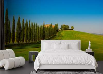 Villa in Tuscany with cypress road and blue sky, idyllic seasonal nature landscape vintage hipster background Wall mural