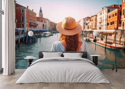 Back view of a girl wearing hat travelling in Venice, Italy. Generative AI Wall mural