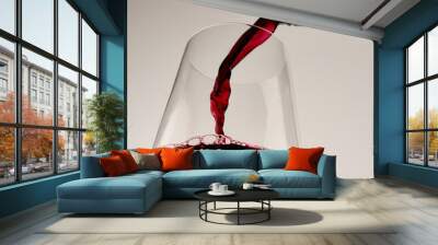 Pouring red wine into wine glass Wall mural