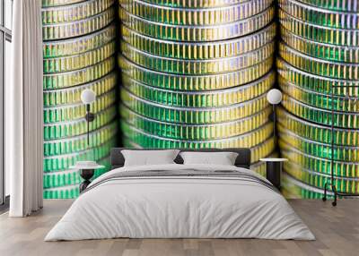 coins of silver color illuminated with yellow green color Wall mural