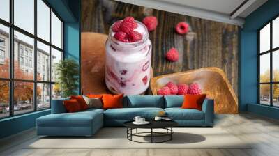 Milk yogurt with raspberries, close up Wall mural