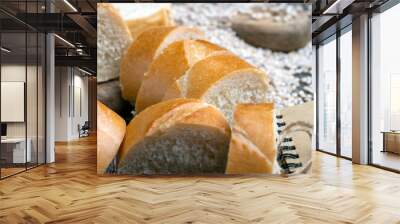 pieces of wheat baguette on a cutting board Wall mural