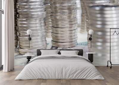 silver-colored metal coins stacked together on American dollars Wall mural