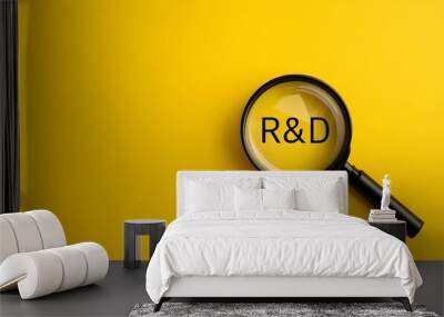 R&D, Research and Development, magnifying glass on a yellow background, close-up photography with text R&D, innovation  Wall mural