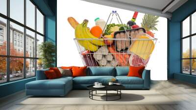 shopping basket full of fresh food isolated on white. Wall mural