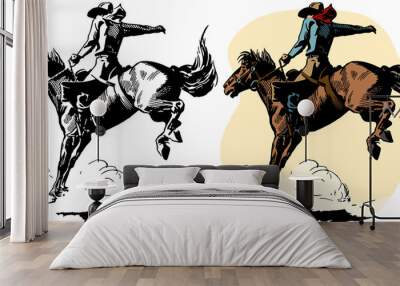 A cowboy rides a bucking bronco in a rodeo performance. Wall mural