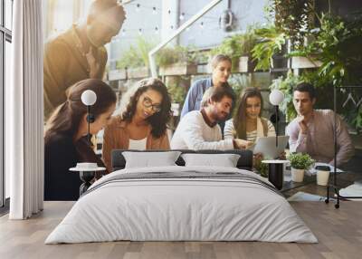 Where productivity flourishes. a group of colleagues having a meeting at a cafe. Wall mural