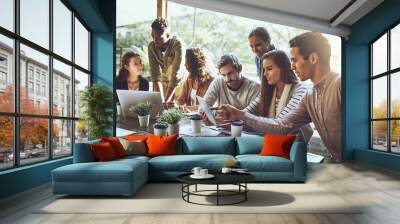 Breaking away from the office to do business. Shot of a team of colleagues using a digital tablet and laptop together during a meeting at an outdoor cafe. Wall mural