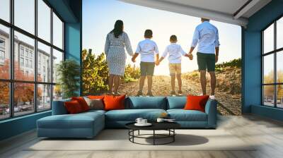 Families stand together forever, no matter what. Rearview shot of a family bonding together outdoors. Wall mural