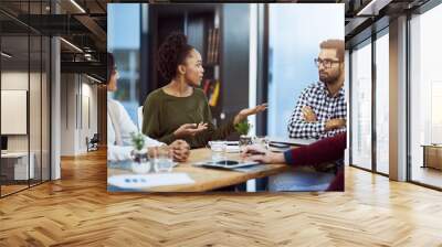 Trying to impress her boss with her ideas. Shot of a group of businesspeople having a meeting in the boardroom. Wall mural