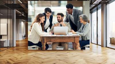 Weighing up all the options. Cropped shot of a group of businesspeople meeting in the boardroom. Wall mural