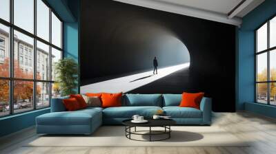 Silhouette of a man with light at the end of a tunnel Wall mural