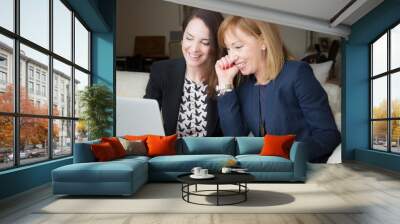 Two successful businesswomen getting good news. Wall mural