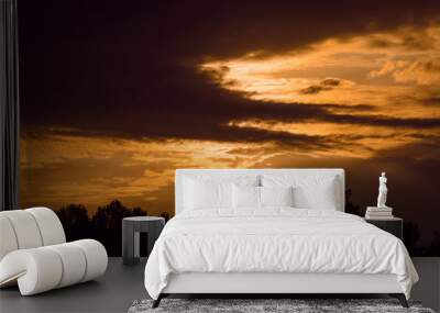 dark sunset with cloudy sky Wall mural