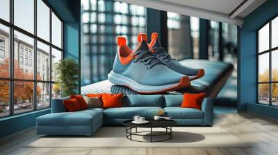 A stylish pair of trainers shoes displayed on a gym bench, emphasizing the importance of footwear in a workout environment Wall mural