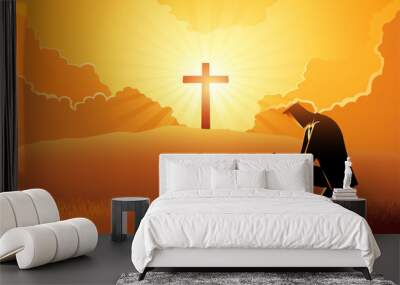 Man praying with a cross and a light burst on a hill in the background Wall mural