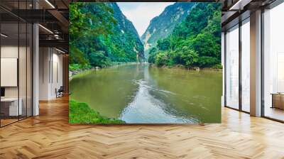 Beautiful view with a river flanked by two hills. Silokek, Sijunjung, Sumatra Barat, Indonesia. Wall mural