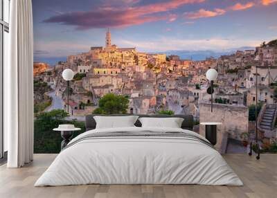 Matera, Italy. Cityscape aerial image of medieval city of Matera, Basilicata Italy at beautiful summer sunset. Wall mural