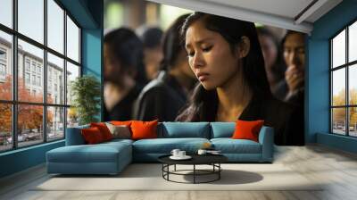 Asian woman in mourning at a funeral, shallow depth of field.Funeral Concept Wall mural