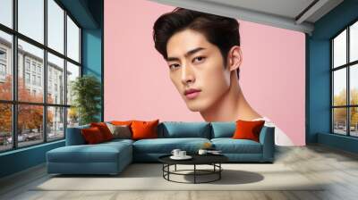 Portrait of a beautiful young asian man on pink background.asian beauty Wall mural