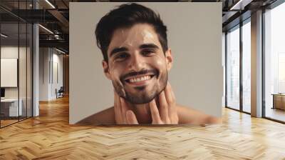 Portrait of Young handsome man applying cosmetic cream on his face. Skin care concept.Generative Ai Wall mural