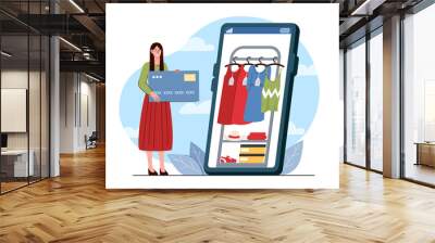 Woman buy clothes online. Young girl with bank card near huge smartphone with clothes. Electronic commerce and marketing. Fashion and style. Flat vector illustration isolated on white background Wall mural