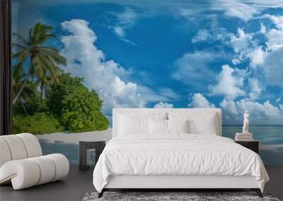 A beautiful beach with palm trees and a clear blue sky Wall mural