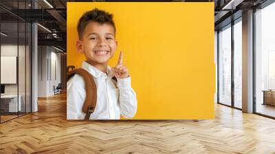 A cheerful boy with short hair Wall mural