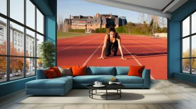 young sportsman on the running track Wall mural