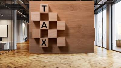 Tax with wooden alphabet blocks, on plank wooden background with copy space Wall mural