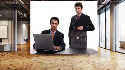 two young business man working with laptop Wall mural