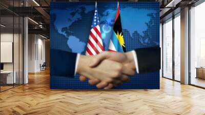 Two person shaking hands in front American,Antigua and Barbuda flags.Antigua,US bilateral relation concept background Wall mural