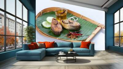 Ilish bhaji for Panta ilish, Bengali new year festive dish. Fried Hilsha slices with chilli, tomato and onion. Hilsa fry is popular in pohela boishakh. on kula. Wall mural