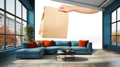 Right hand holidng a brown paper bag isolated on white with clipping path. Wall mural