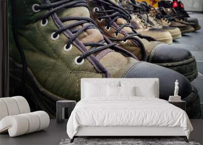 a close up shot of army training boot, shoes lined up after a run. Uttarakhand India. Wall mural